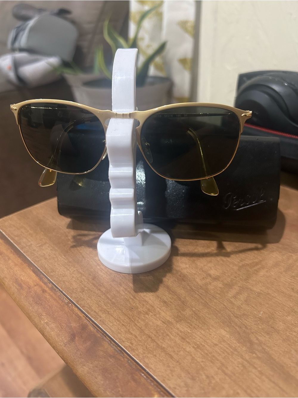 Persol Gold Frame Sunglasses with Dark Lenses